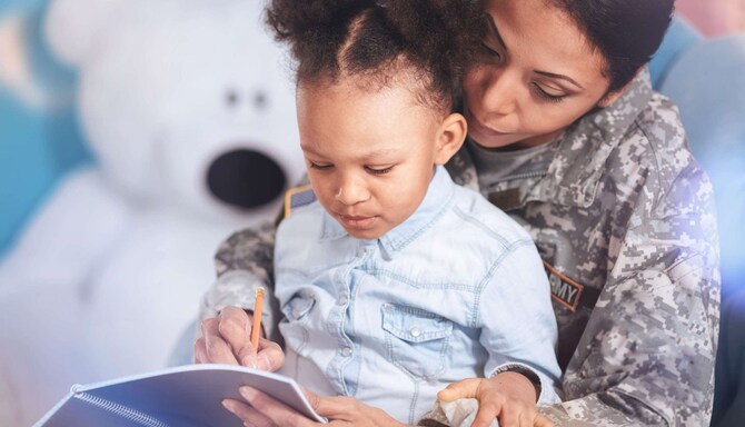 Mother in Army uniform holding daughter