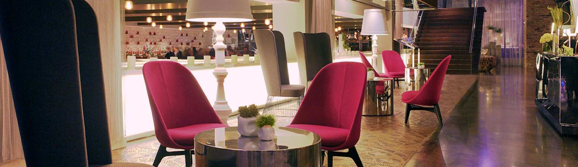 A seating area with chairs and coffee tables