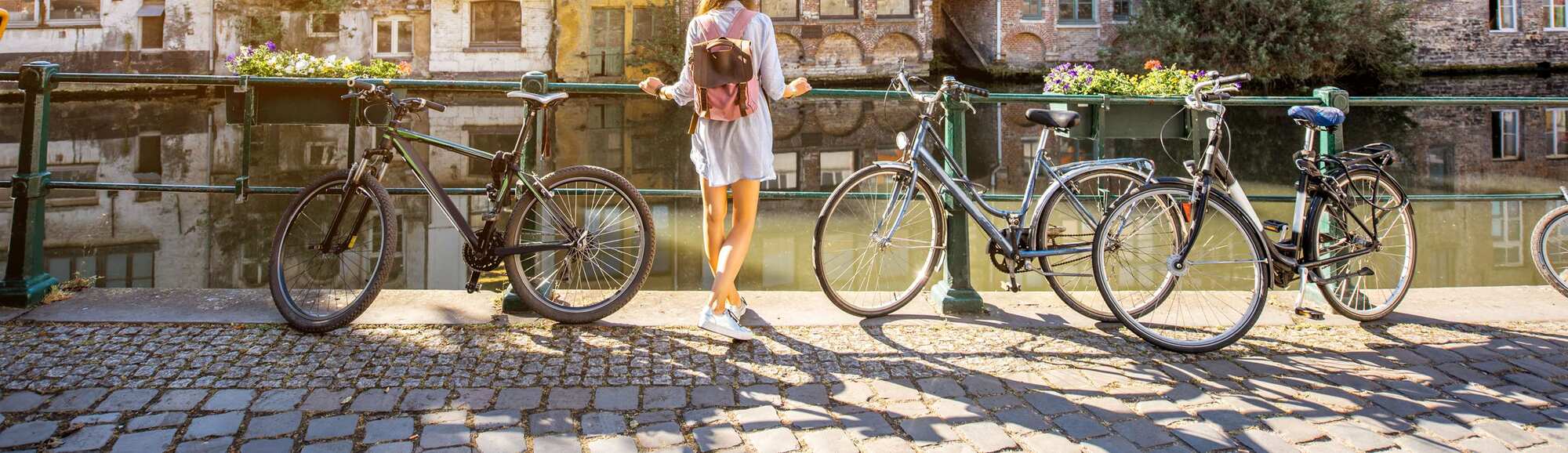 Offers and Packages - Experience Package - Local - Girl with a bike by the canal