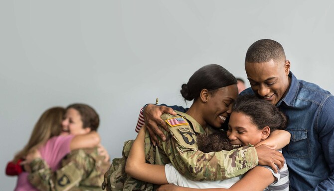 Military women embracing their families