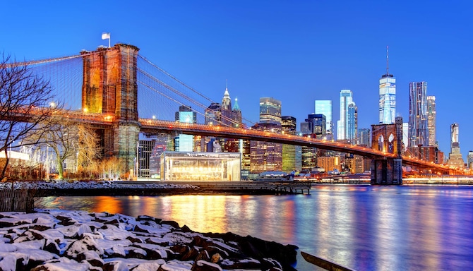 Evening view of the Brooklyn Bridge with New York City in the background
