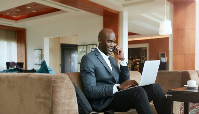 Radisson Rewards Brand - Business guest in the lobby
