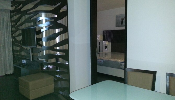 Ambar Sarovar Portico Gandhidham - Suit room dining amp T V area