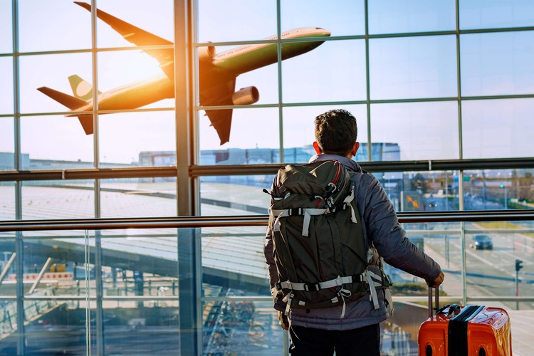 Blog images - 2023 - The four best places for vacation in October Man watching plane hero