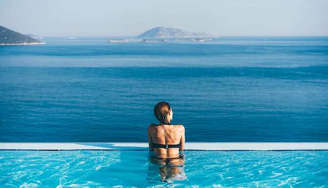 Blog images - 2023 - Enjoy the Perfect Getaway at our Adults Only Resorts Woman Enjoying View hero