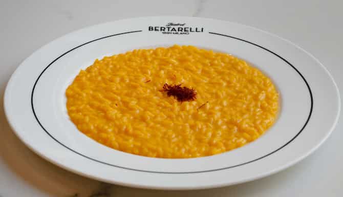 Blog images - 2023 - Culinary Tales Flavors of Milan with Luca Milanese Saffron Risotto Recipe risotto on a white table