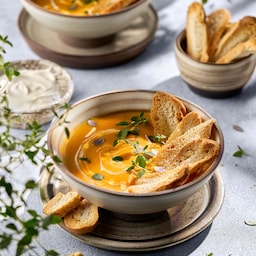 Blog images - The best Polish Traditional Food to fall in love with - soup with the bread on table