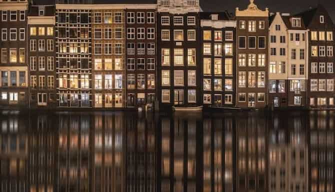 Blog images - Typical Amsterdam houses along canal at night - Top 5 Things to do in Amsterdam this Winter