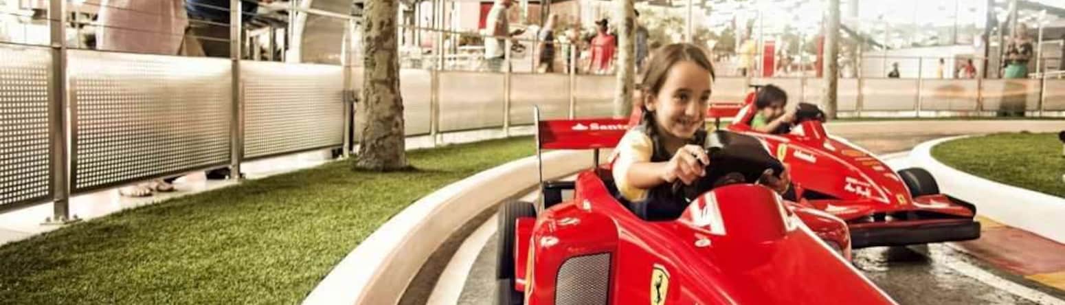 Blog images - Ferrari World Yas Island Abu Dhabi children racing mini ferraris on a track - Ferrari World