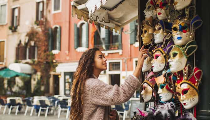 Blog images - Top Events to Experience in Venice-tourist looking at masks