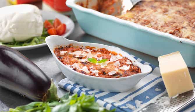 Blog images - A Culinary Journey: Unveiling the Best Italian Dishes -  Melanzane alla Parmigiana on the table
