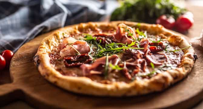 Blog images - A Culinary Journey: Unveiling the Best Italian Dishes - pizza on wood