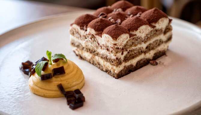 Blog images - A Culinary Journey: Unveiling the Best Italian Dishes - Tiramisu on plate