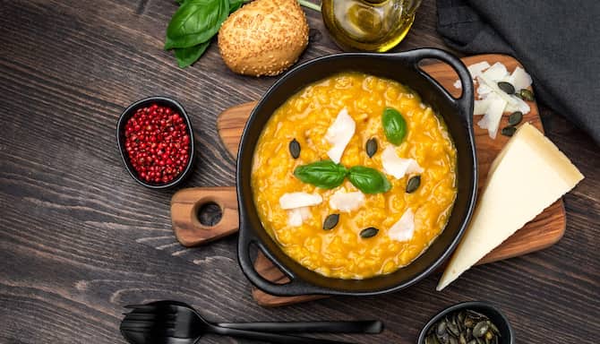 Blog images - A Culinary Journey: Unveiling the Best Italian Dishes - Risotto on a wooden plate