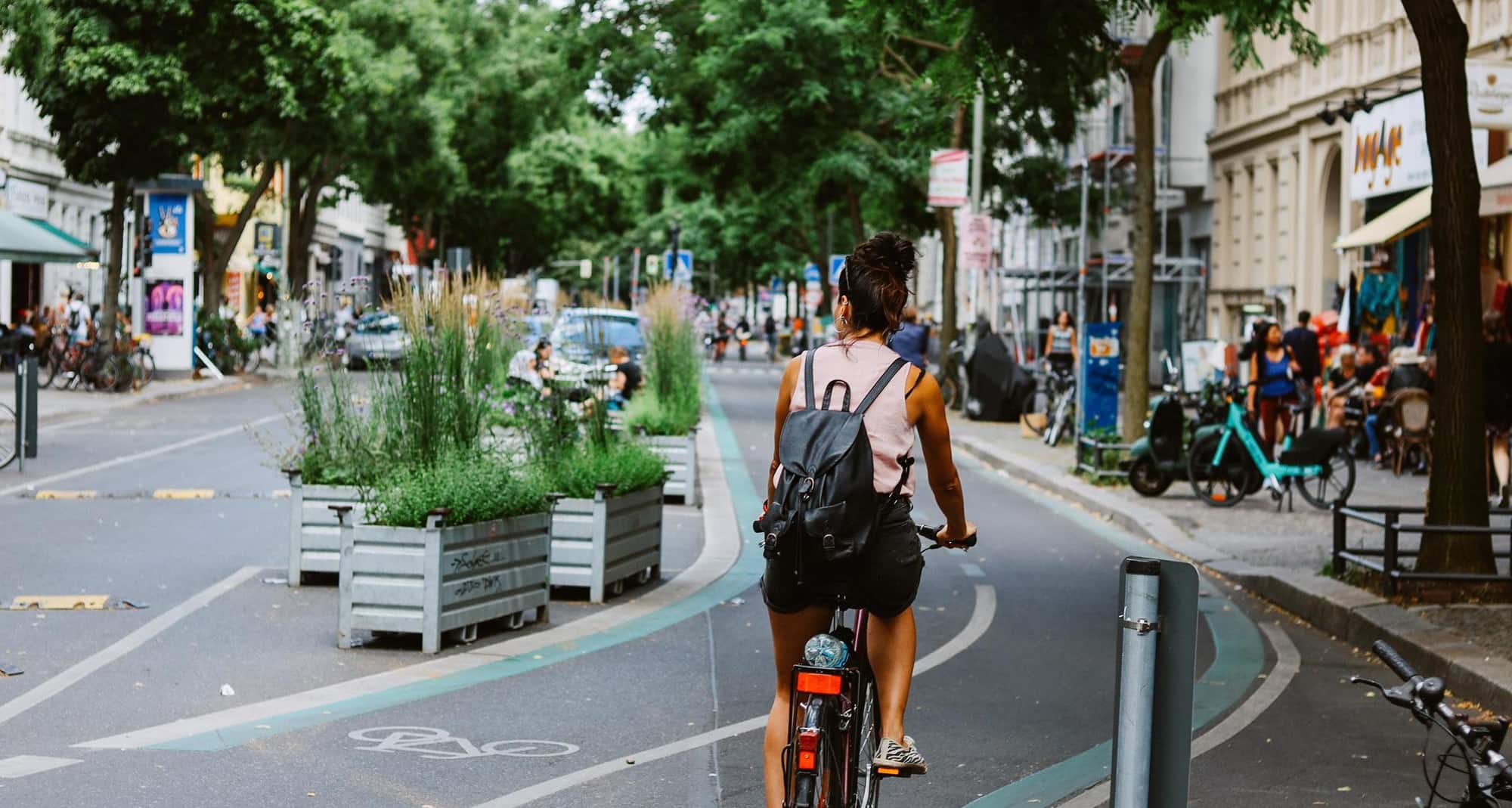 Blog images - 2025 - Things to Do in Berlin Exploring the Vibrant German Capital Destination Woman riding a bicycle on t