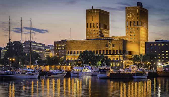Blog images - 2025 - Things to Do in Oslo A Day Itinerary Destination Oslo City Hall landmark towers overlooking illumi