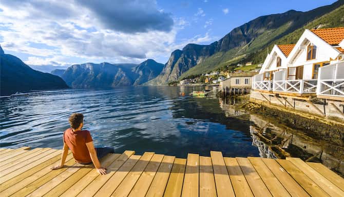 Blog images - 2025 - Oslo to Norwegian Fjords A Scenic Journey Experiences Wooden pier admiring a Norwegian Fjord Wester