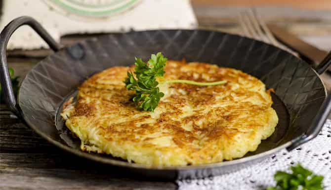 Blog images - 2025 - Zurich restaurants a culinary journey awaits Food amp Drink Frying pan with potato roesti