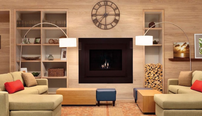 Living room with two facing sofas with a fireplace and stylish décor