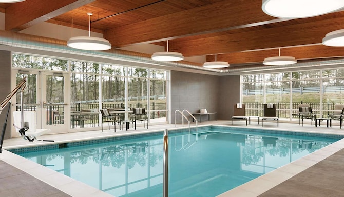 Pool area with chairs and tables