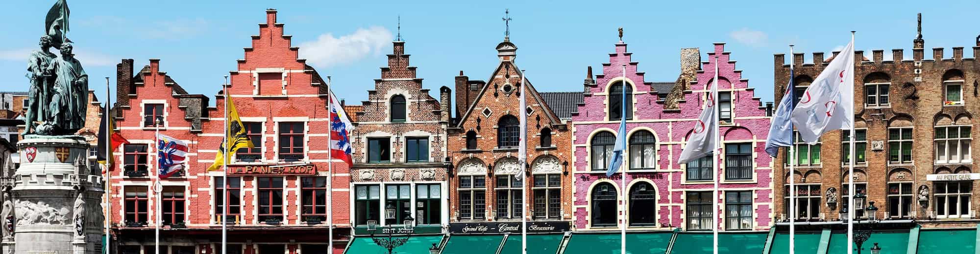 Destination Pages - Statue and Colorful Buildings in Bruges