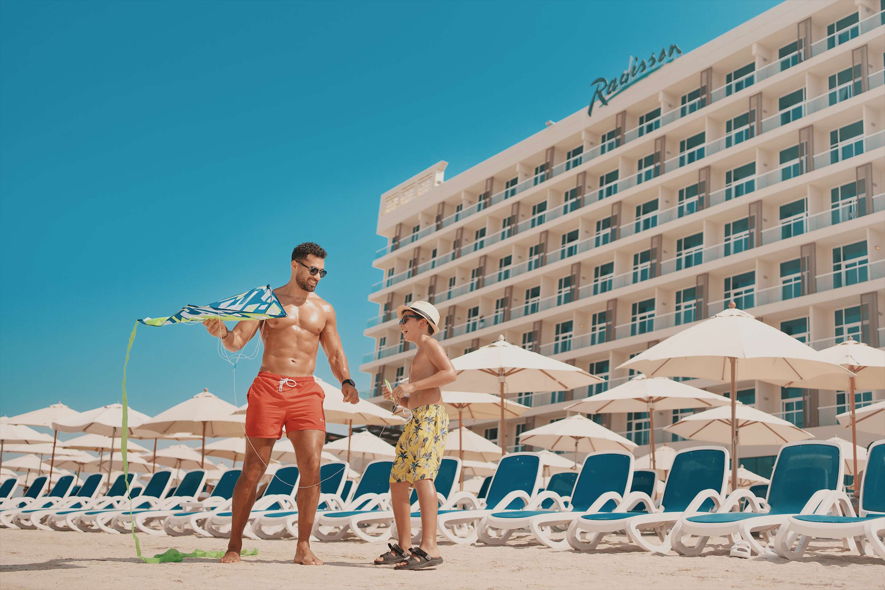 Dad and son having fun in Radisson Ras Al Khaimah Marjan Island