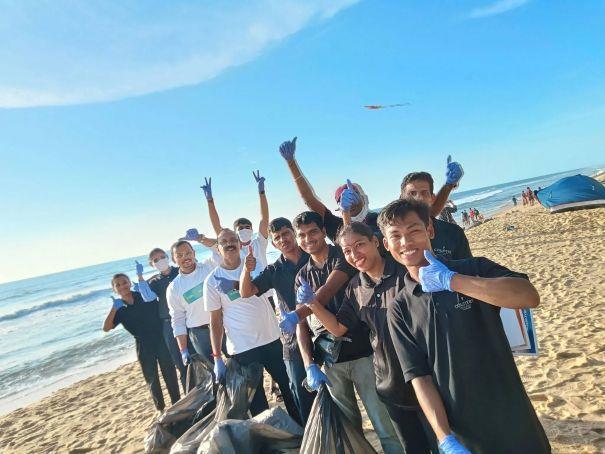 A hotel team participates in Radisson Hotel Group s Action Month with a community beach clean-up.