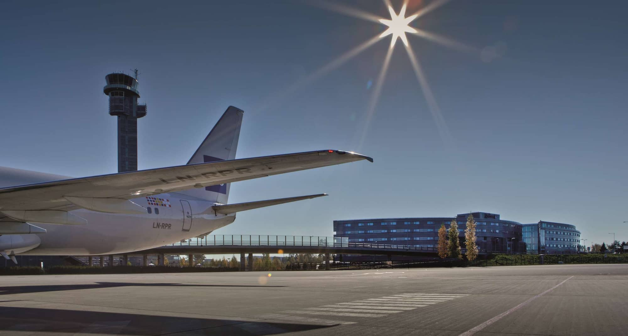 Radisson Blu Airport Hotel, Oslo Gardermoen - Airplane with hotel exterior as background