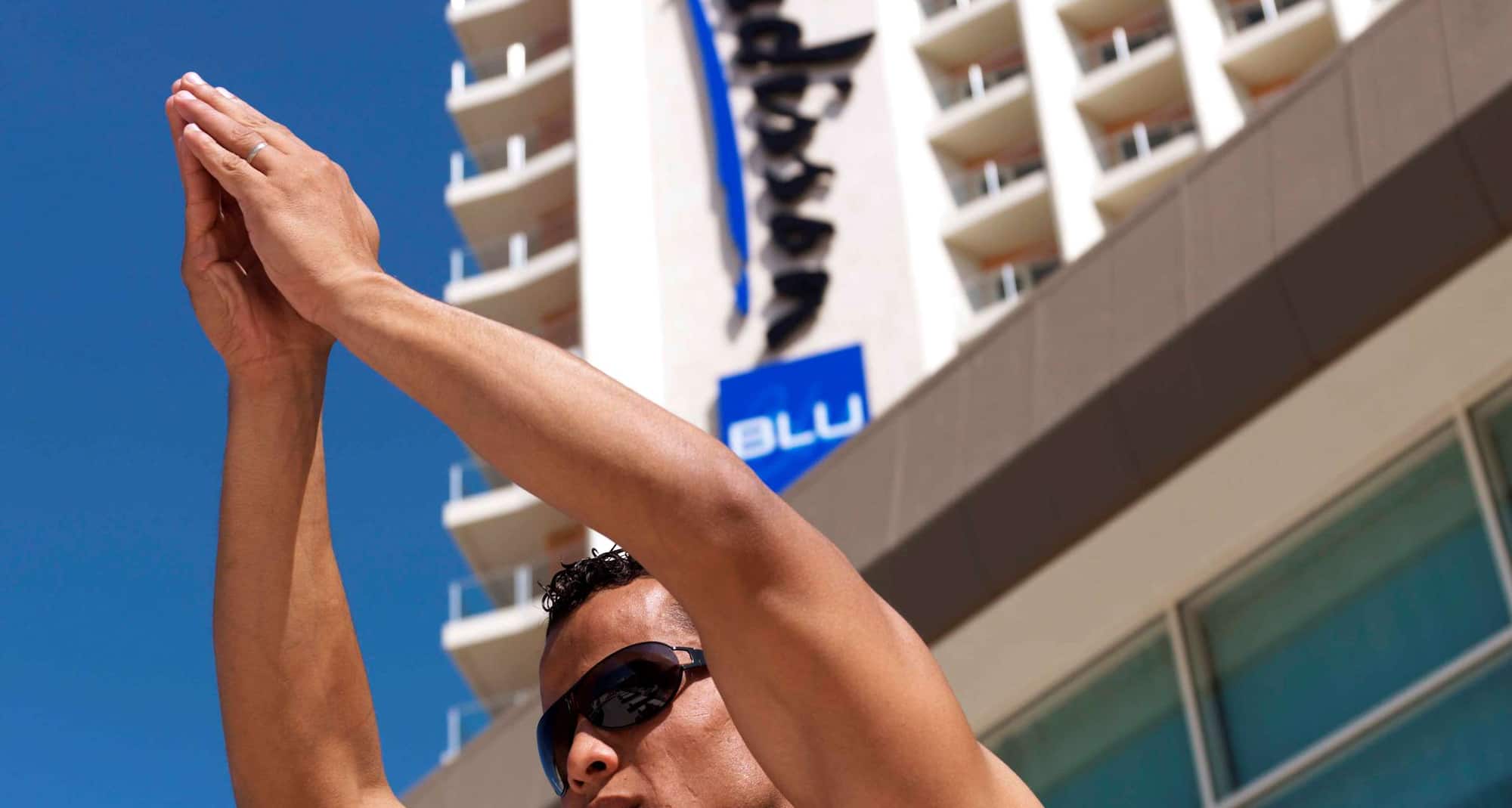 Al Mahary Radisson Blu Hotel, Tripoli - Guest standing in front of RDB logo