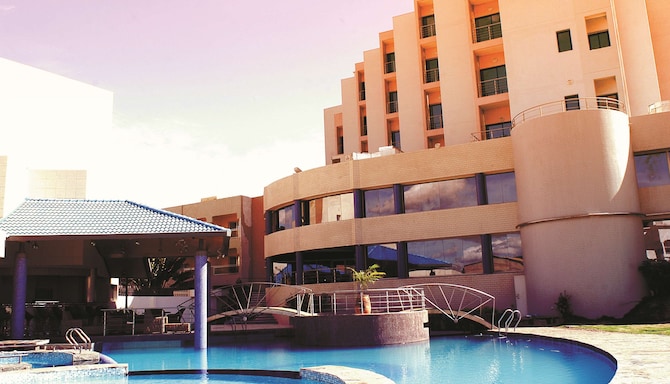Radisson Blu Hotel, Bamako - Hotel Exterior View from Pool