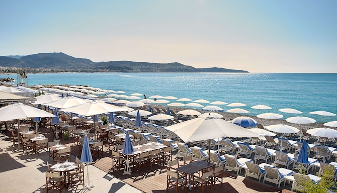 Radisson Blu Hotel, Nice - Beach Sunbeds and Dining Tables