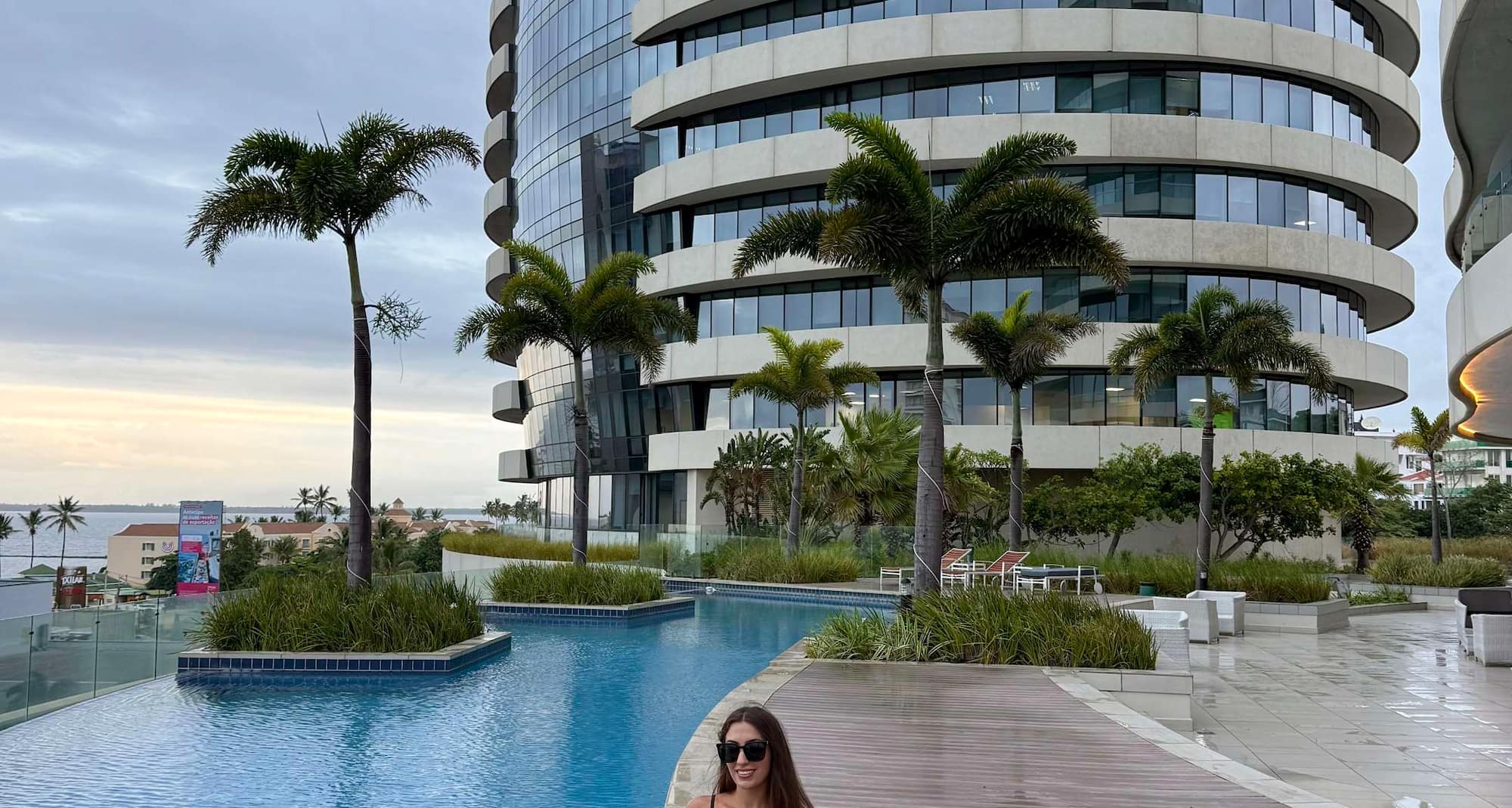 Woman sitting by the pool
