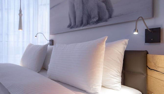 Radisson Blu Hotel, Reussen Andermatt – Standard Zimmer – Bett
