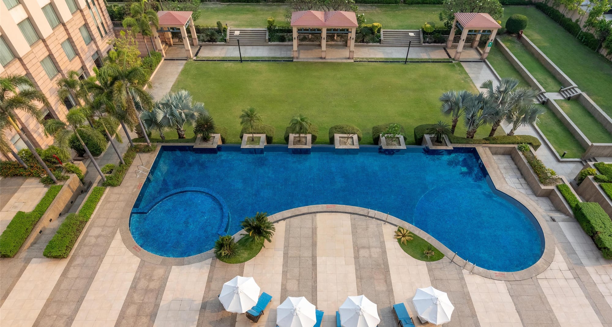 Radisson Blu Hotel, Rudrapur - Lawn and Pool