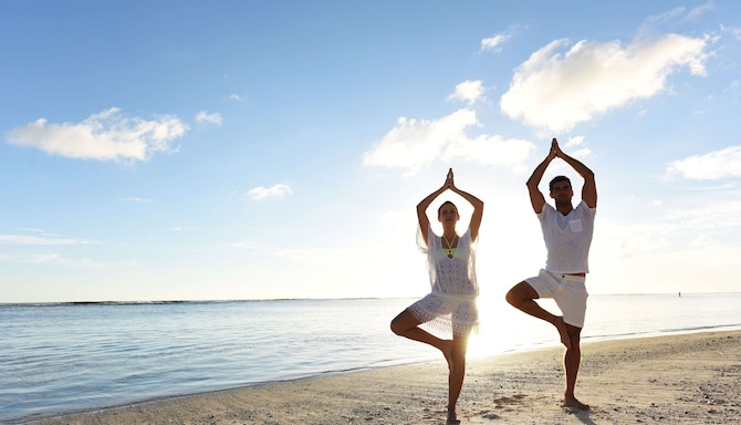 Radisson Blu Poste Lafayette Resort & Spa, Mauritius - Guests Doing Yoga at the Beach