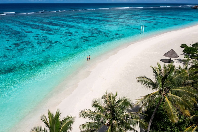 Radisson Blu Resort, Maldives - Couple on hotel beach