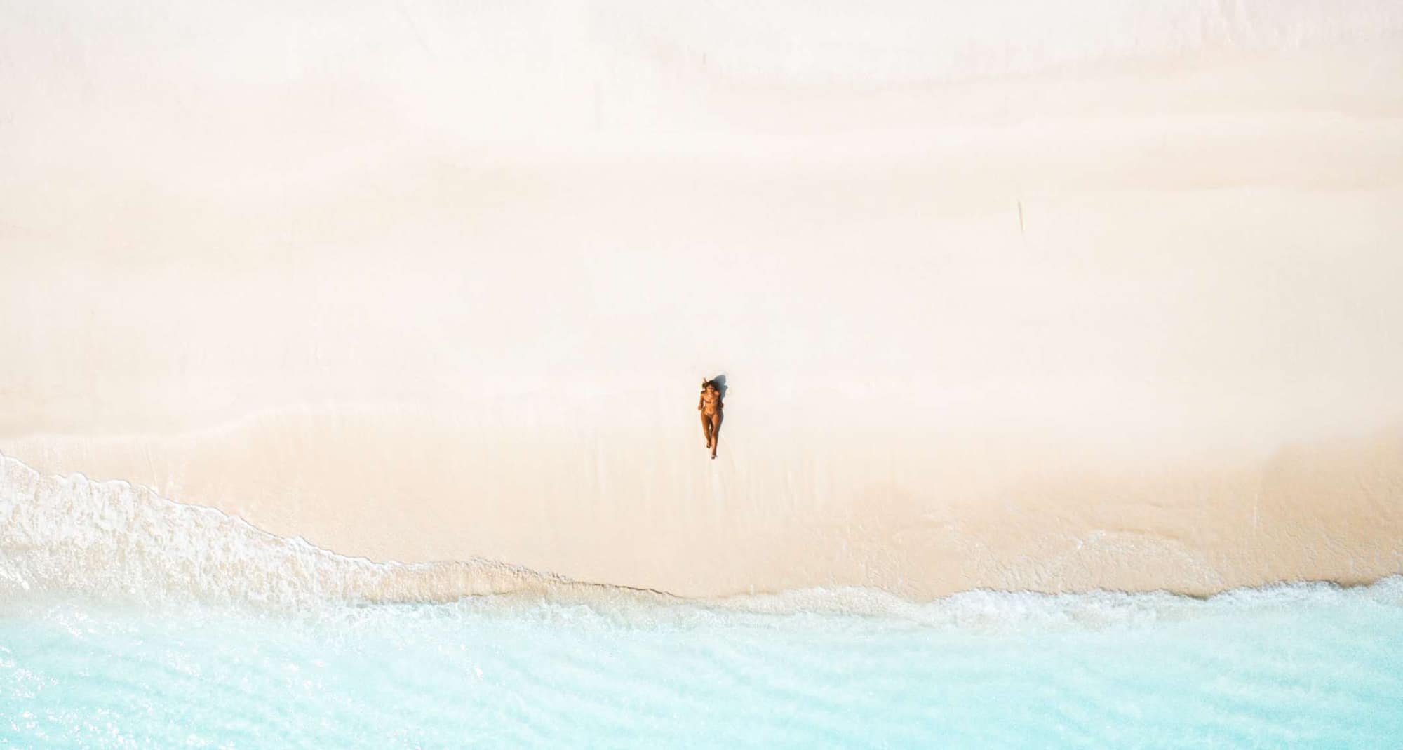 Radisson Blu Resort, Maldives - Woman on Beach birds eye view