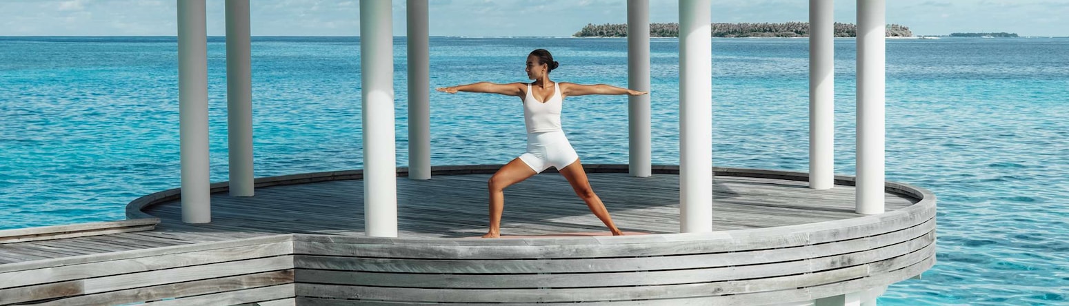 Radisson Blu Resort, Maldives - Blu spa yoga pavillion woman in pose