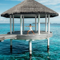 Radisson Blu Resort, Maldives - Blu spa yoga pavillion woman in pose