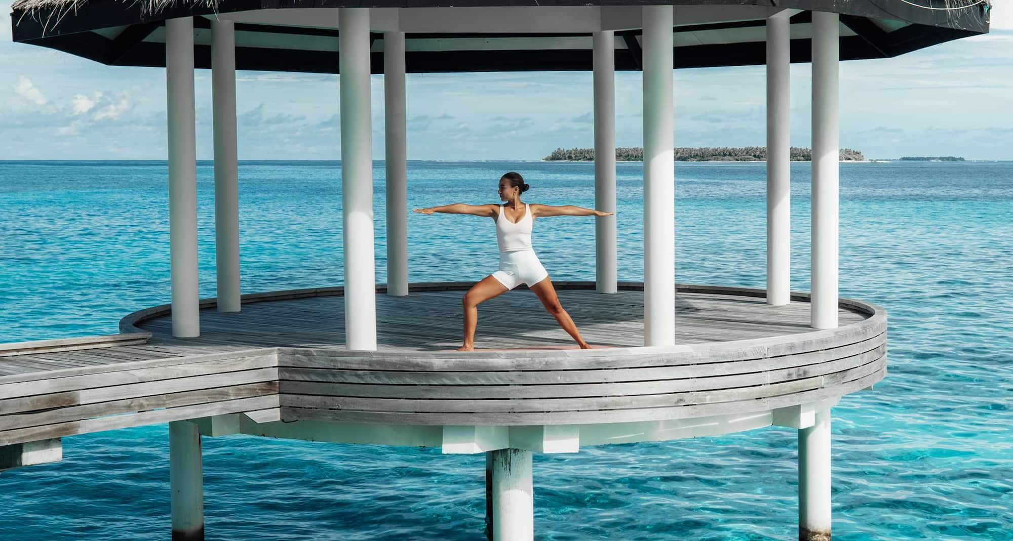 Radisson Blu Resort, Maldives - Blu spa yoga pavillion woman in pose