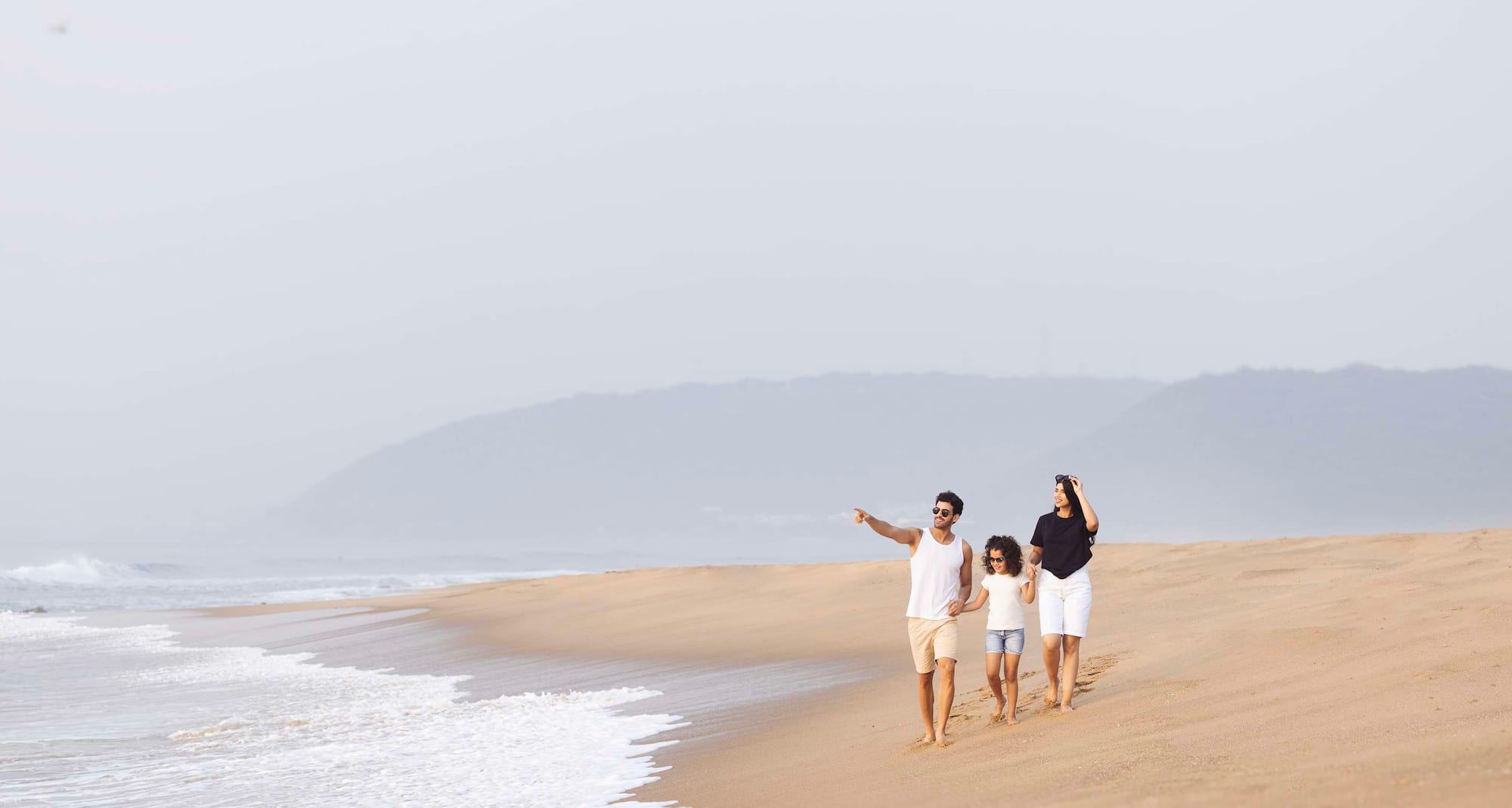 Families find sunshine, serenity, and simple joy along this inviting coastal stretch