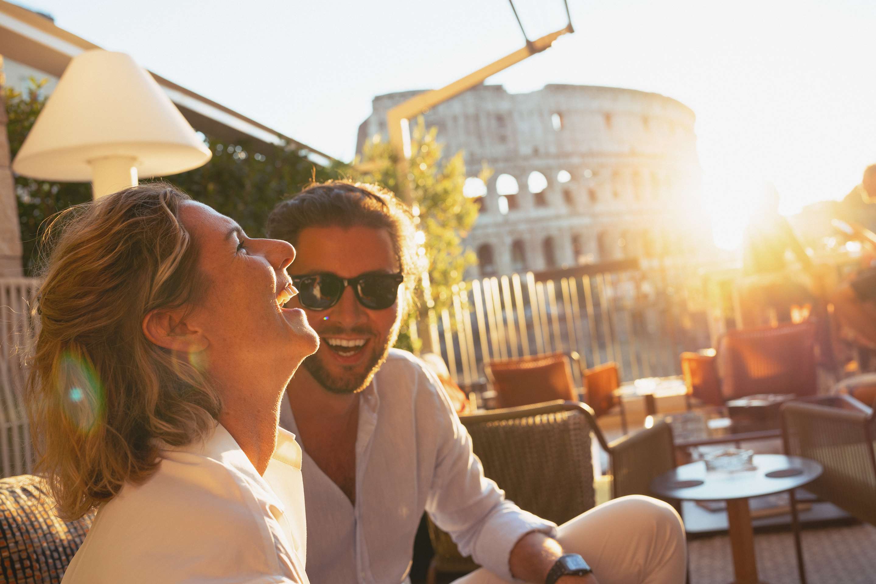 Radisson Collection - Couple enjoying the susnet on rooftop terrace