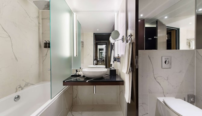 Radisson Collection Hotel, Berlin - Bathroom with tub and rainshower
