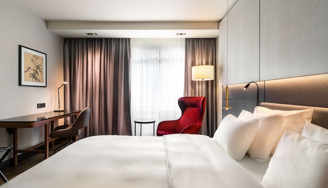 Radisson Collection Hotel, Grand Place Brussels - Collection Room with king-size bed, desk, and armchair