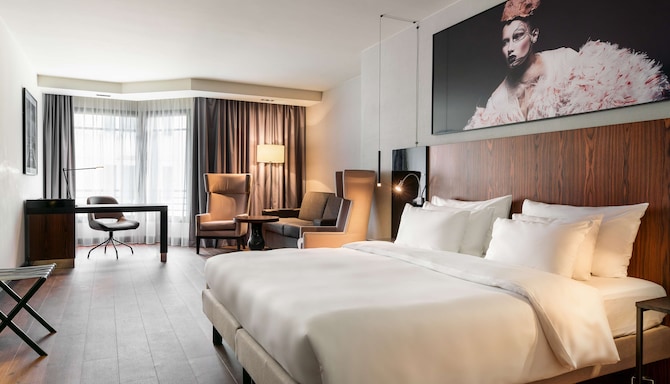 Radisson Collection Hotel, Grand Place Brussels - Junior Suite desk, sitting area, and sofa-bed