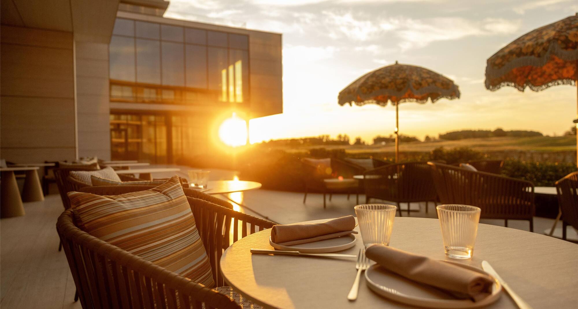 Radisson Collection The National Hotel, Brussels - STOKE Outdoor Terrace seating in sunset