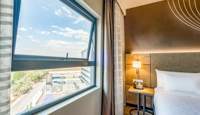 Radisson Hotel and Convention Centre OR Tambo Airport - Standard Twin Room- Pool View