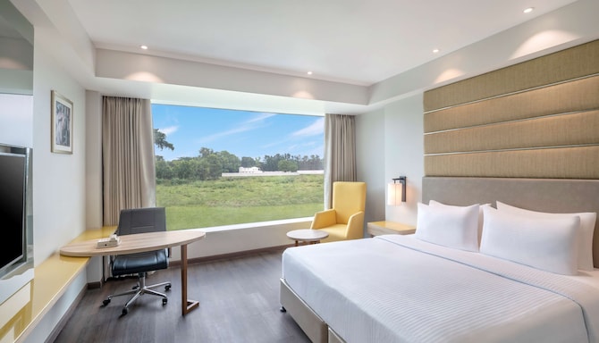 Radisson Hotel Bareilly Airport - Deluxe Room king size bed