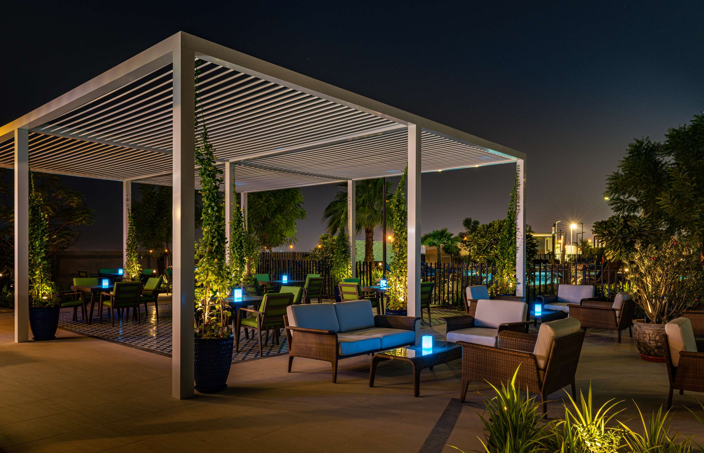Radisson Hotel Dubai Damac Hills - The Hills Pool Deck - pergola night time
