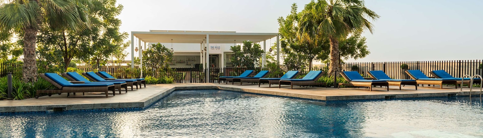 Radisson Hotel Dubai Damac Hills - Hills Pool Deck - Pool & Restaurant view